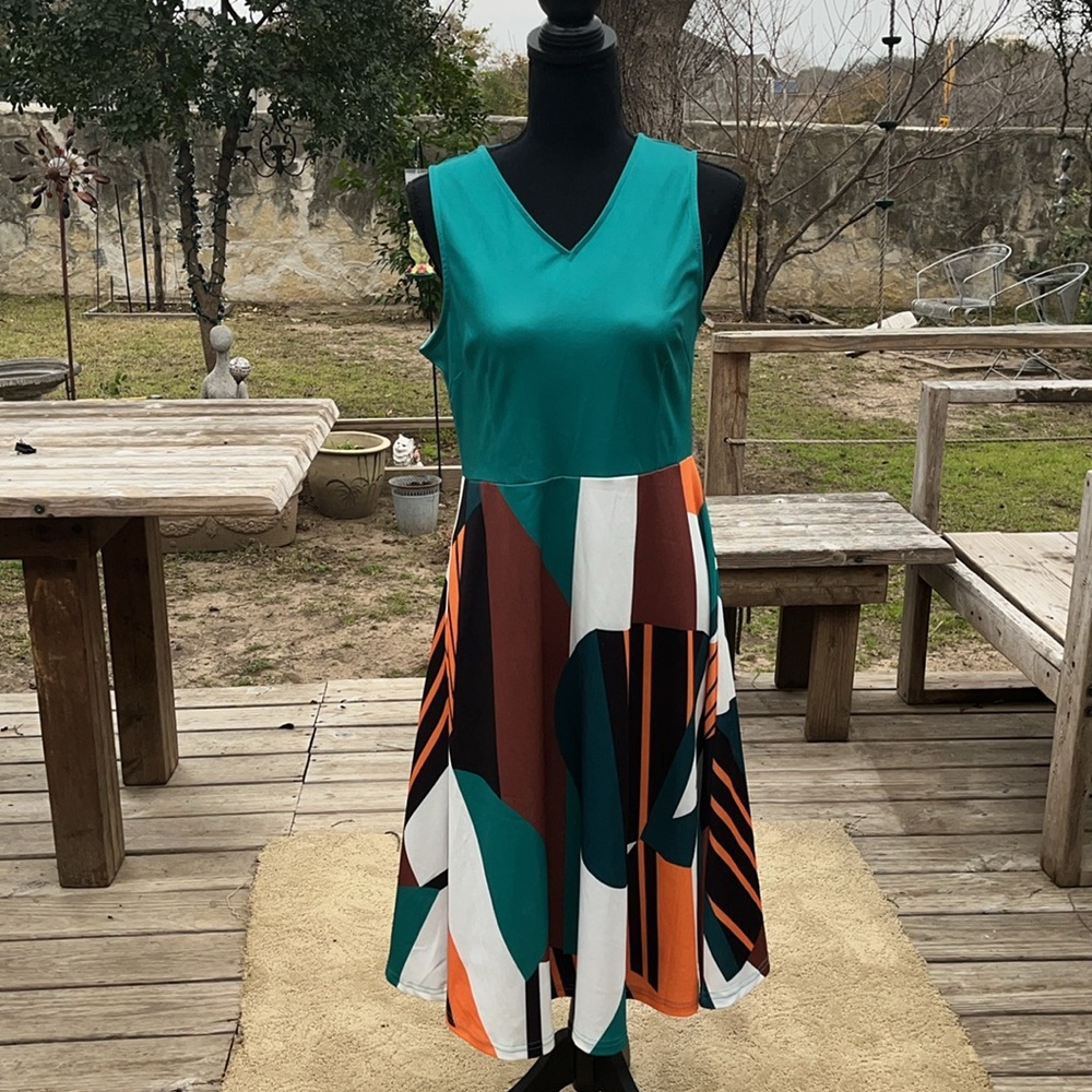 60s style multi color polyester spandex mix. Knee length. Flared skirt. Small.